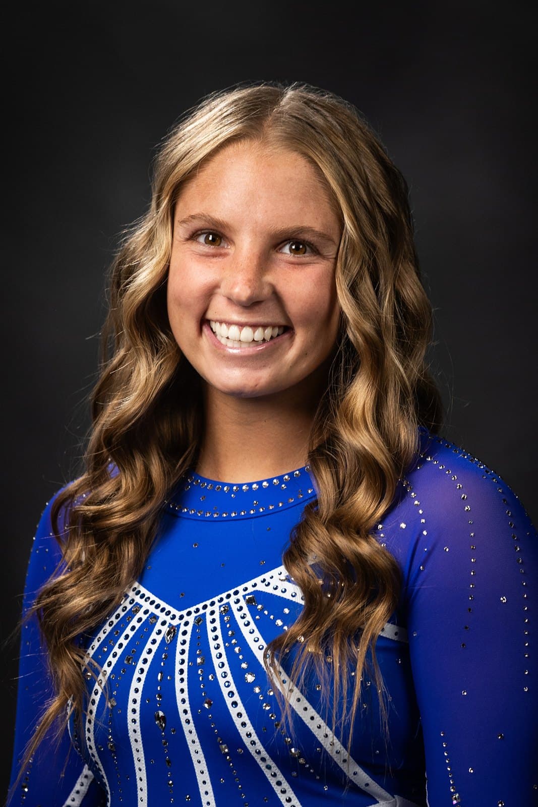 Official BYU roster headshot of gymnast Brynlee Broekman in a royal-blue BYU leotard.