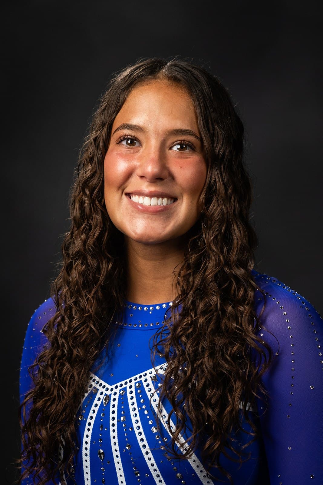 Official BYU roster headshot of gymnast Deb Silva in a royal-blue BYU leotard.